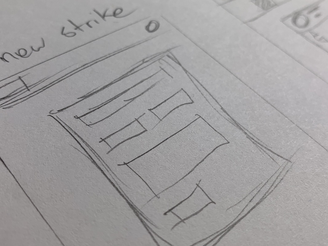 Pencil sketches of interface layouts on paper.